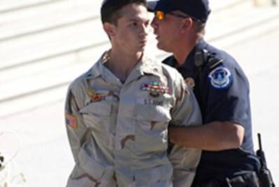 Iraq war veteran, Mike Prysner, being arrested for protesting the war