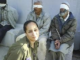 The ugly faces of Israel - soldier posing in front of blindfolded Palestinian prisoners