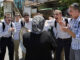 Israeli youths jeer at a Palestinian woman in Sheikh Jarra neighbourhood of Jerusalem who has just been made homeless by settlers