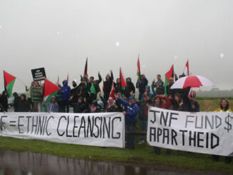 Outside the main gate: a little rain doesn't dampen the spirit of justice