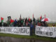 Outside the main gate: a little rain doesn't dampen the spirit of justice