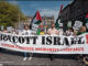 Demonstrating against Israeli crimes; pushing the boycott campaign