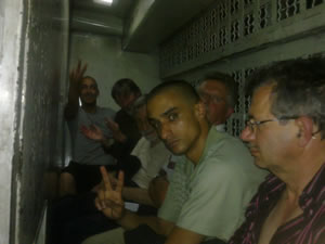 Internationals handcuffed and shackled, detained at Tel Aviv airport 8 July 2011 (in picture Frank Thomas and John Lynes from the UK, 2nd and third form left respectively)