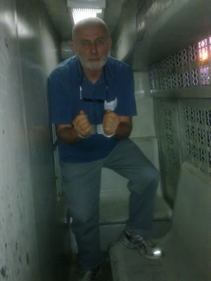 Author in Israeli handcuffs, leg irons and prison van 