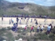 palestinians swarm over the Israeli wall dividing occupied Golan from Syria
