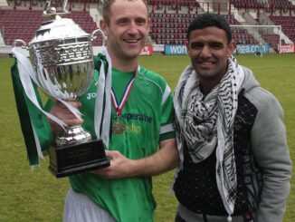 Palestinian footballer Mahmoud Sarsak presenting the Rivals4Charity trophy to Hibs Skipper Frankie Arthur