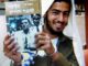 The killer, Eden Natan-Zada, poses with a book by late Rabbi Meir Kahane